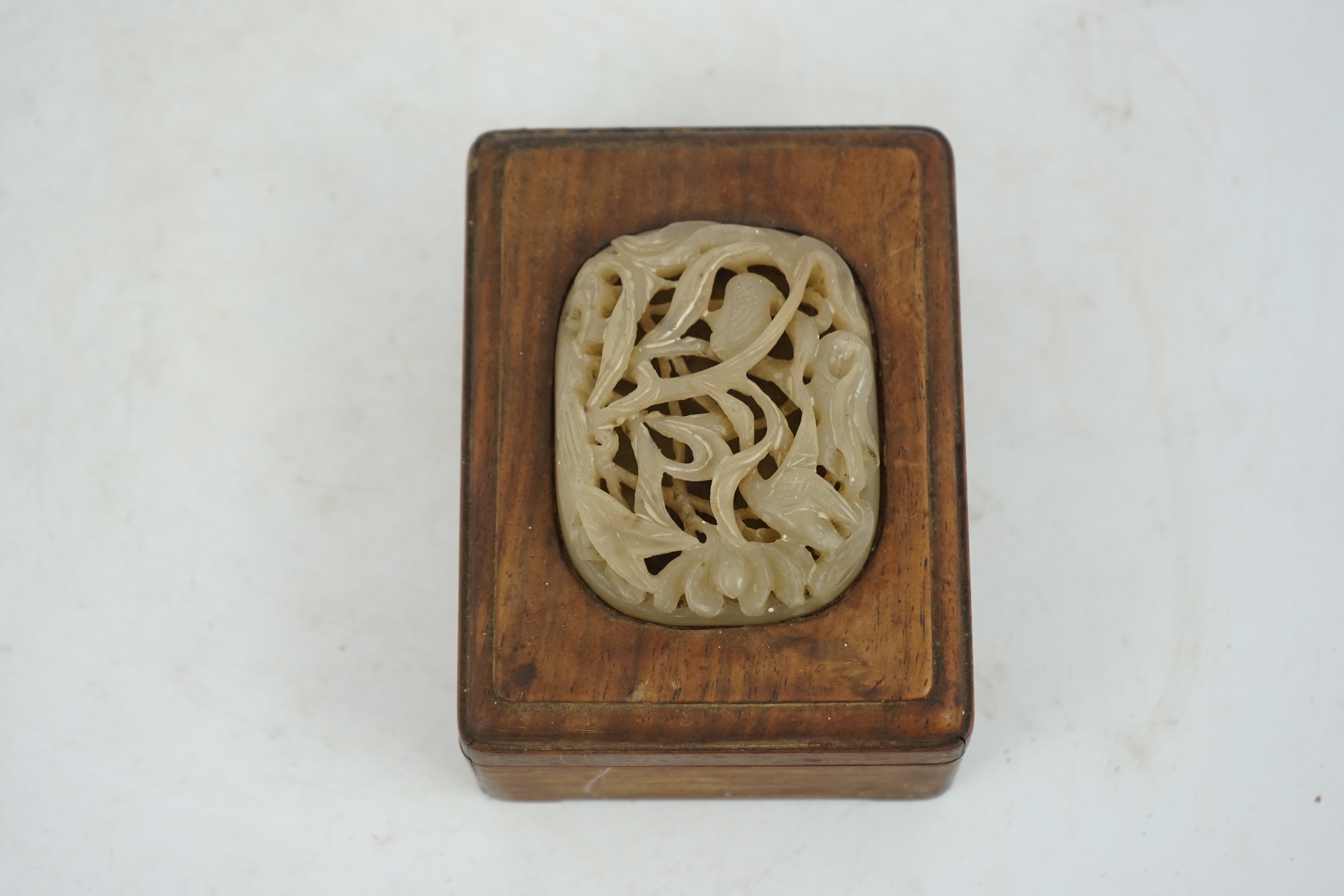 A Chinese pale creamy white jade ‘egret and lotus’ plaque, Yuan-Ming dynasty